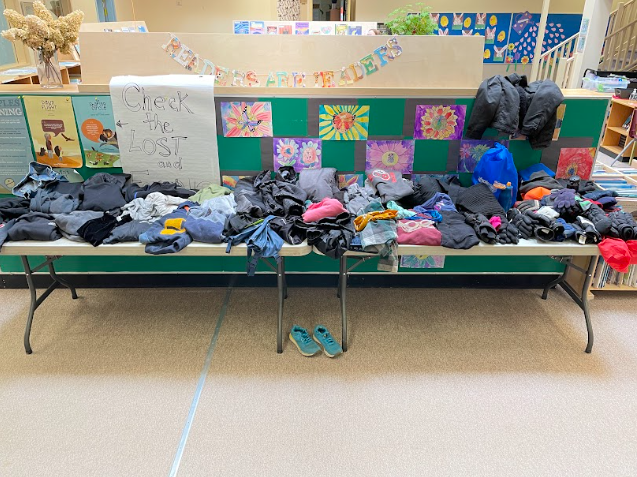A group of clothes on a bench
Description automatically generated