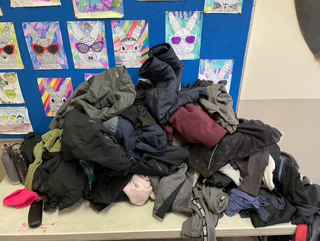 A pile of clothes on a table
Description automatically generated