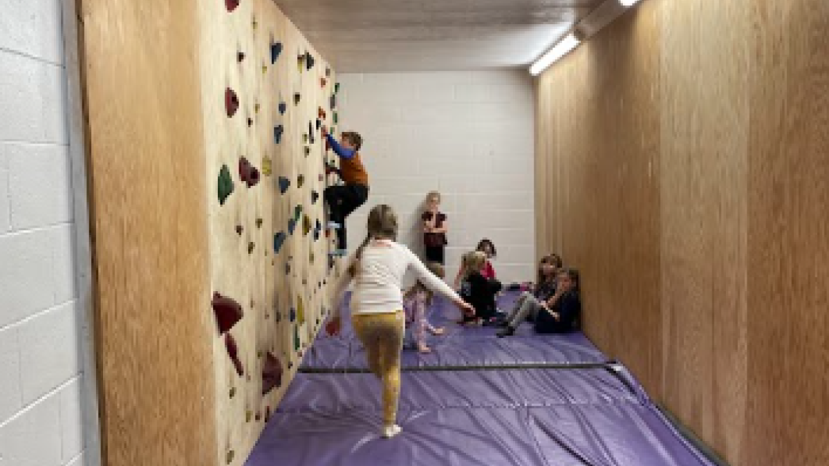 children at climbing wall